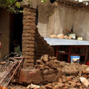 REFILE - ADDING NAME OF CYCLONE  A boy stands at a family home destroyed by floods following Cyclone Idai in Chimanimani district, Zimbabwe, March 18, 2019. REUTERS/Philimon Bulawayo